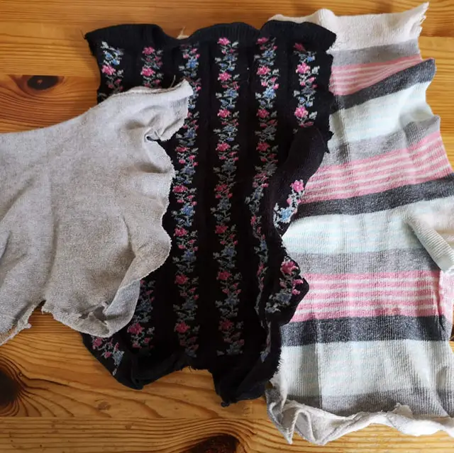 Three socks that have been cut up and made into cloths