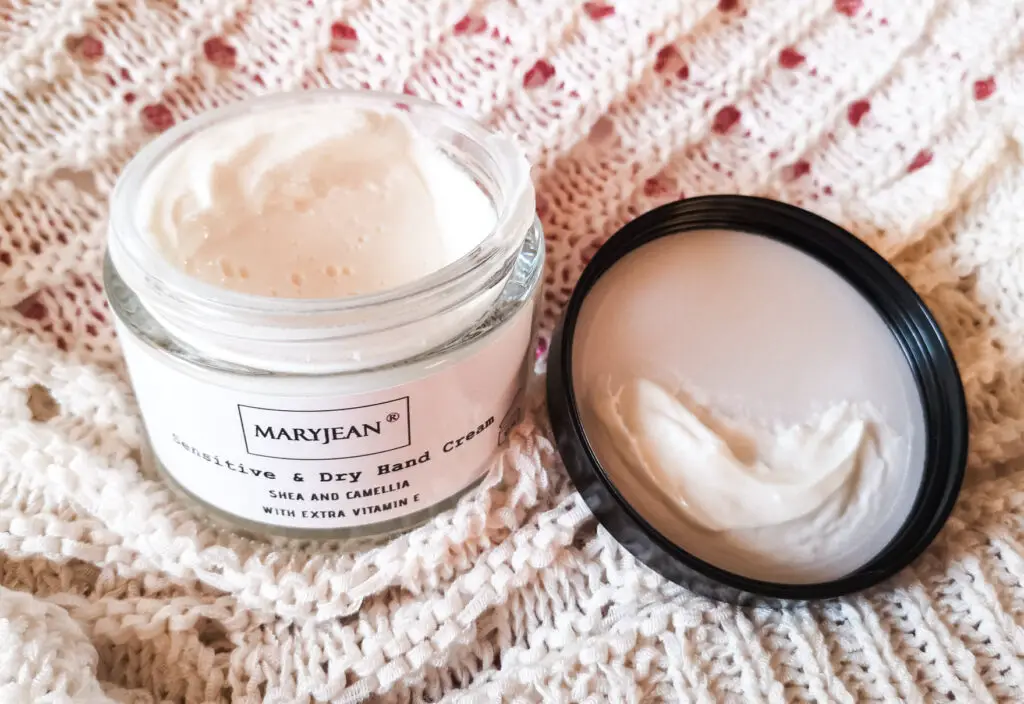 An open pot of Mary Jean Sensitive & Dry Hand Cream.