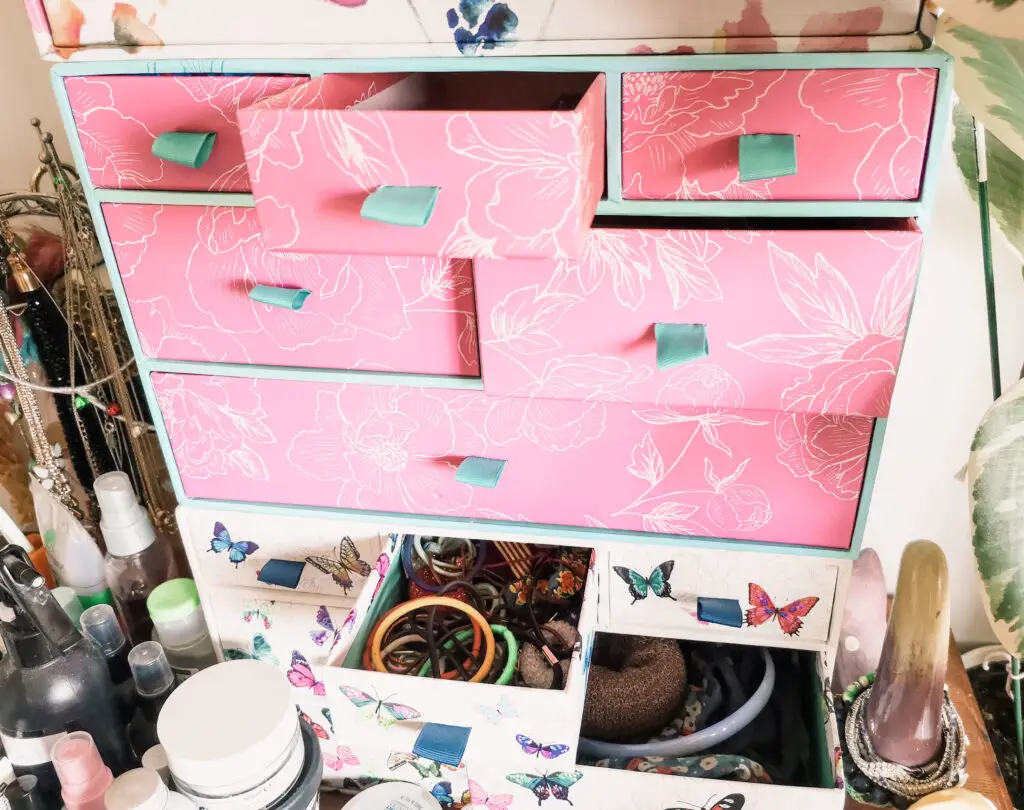 A closer view of some mini drawers with some of them open, showing the contents.