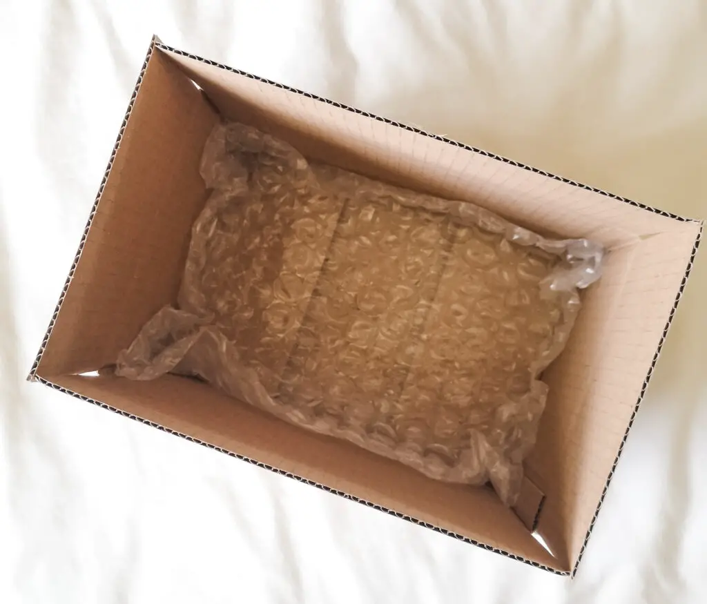 A birds-eye-view of a new cardboard box, with bubble wrap lining the bottom.