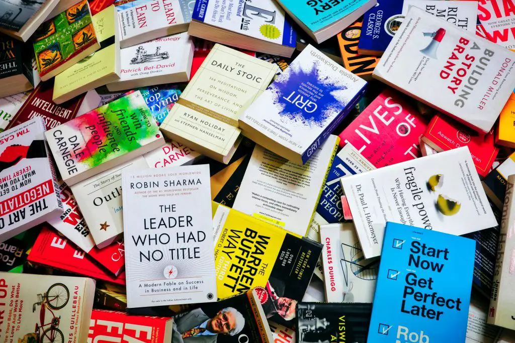 A large pile of self-help books.