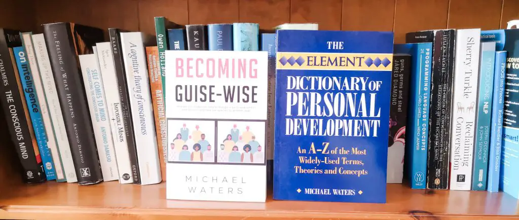 Paperback copies of Becoming Guise-Wise and The Element Dictionary of Personal Development by Michael Waters on a bookshelf.