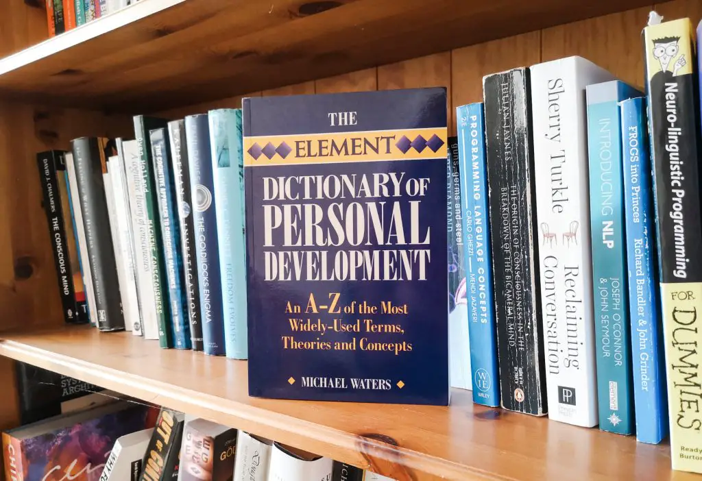 A paperback copy of The Element Dictionary of Personal Development by Michael Waters