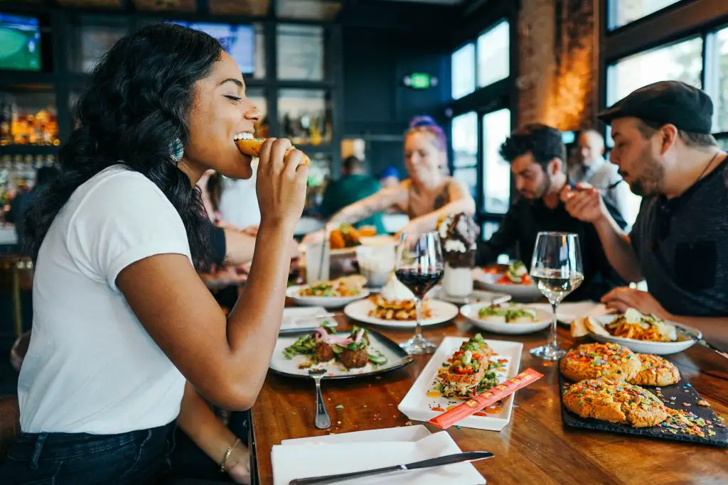 A group of friends enjoying a meal in a restaurant.