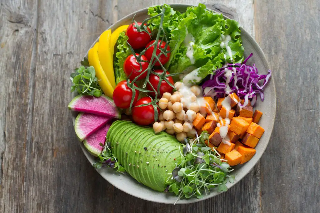 A bowl of colourful, crunchy salad vegetables.