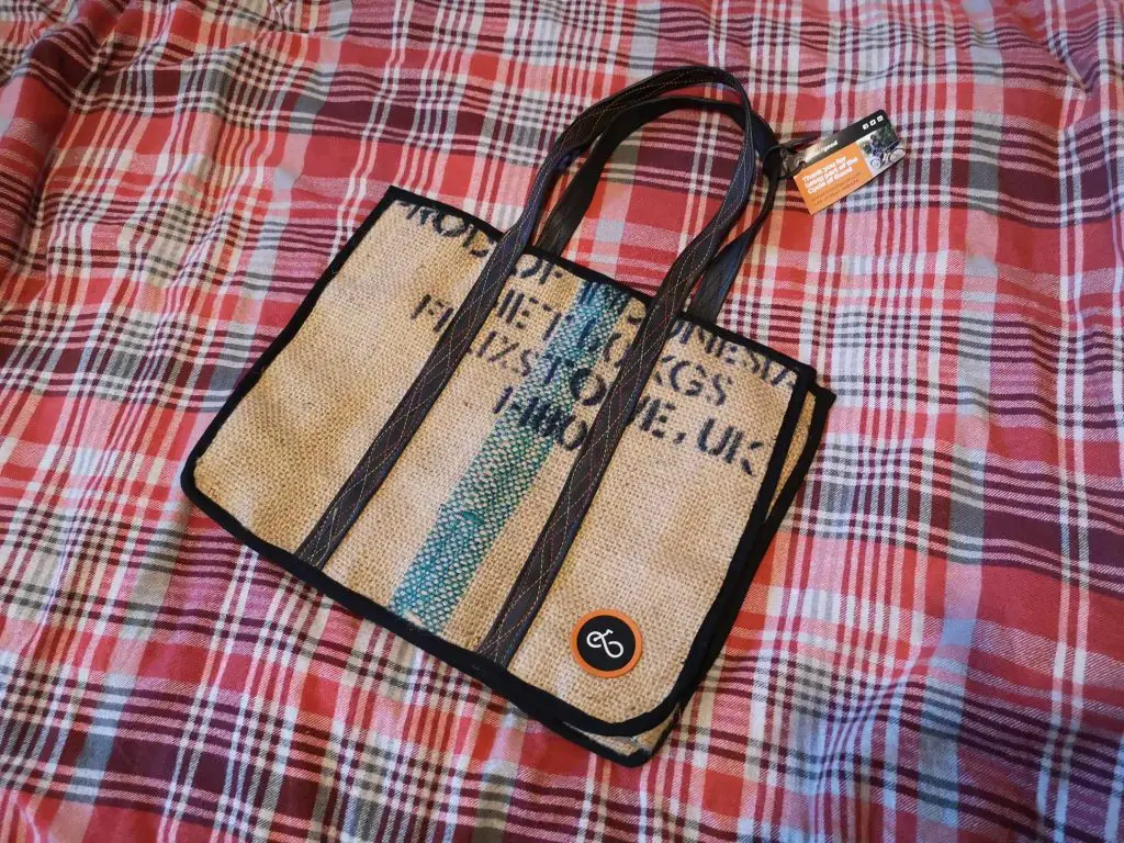 A tote bag made from recycled coffee sacks and inner tubes from bicycle wheels.