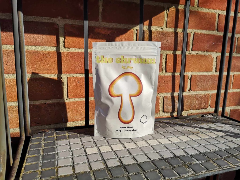 A pouch of The Shruum by Jrny on a shelf outdoors.