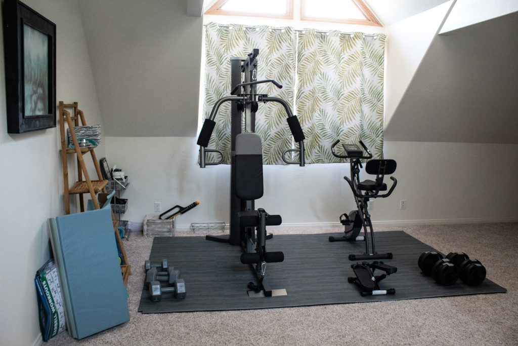 A home gym with various exercise equipment.