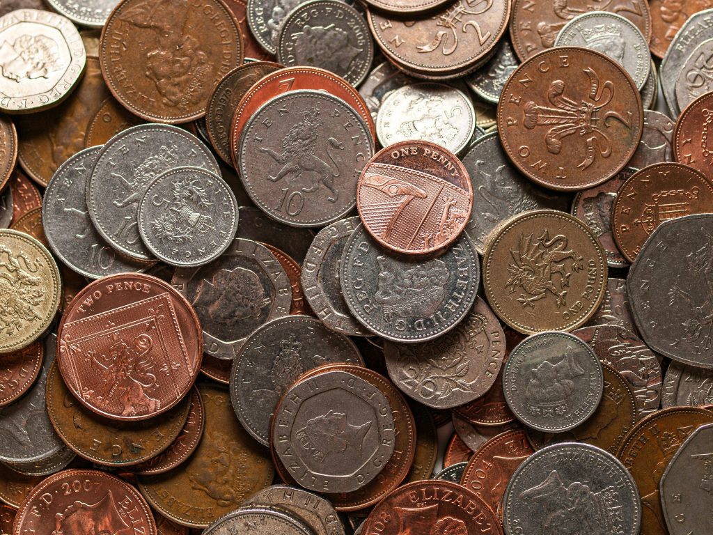 A pile of copper and silver coins.
