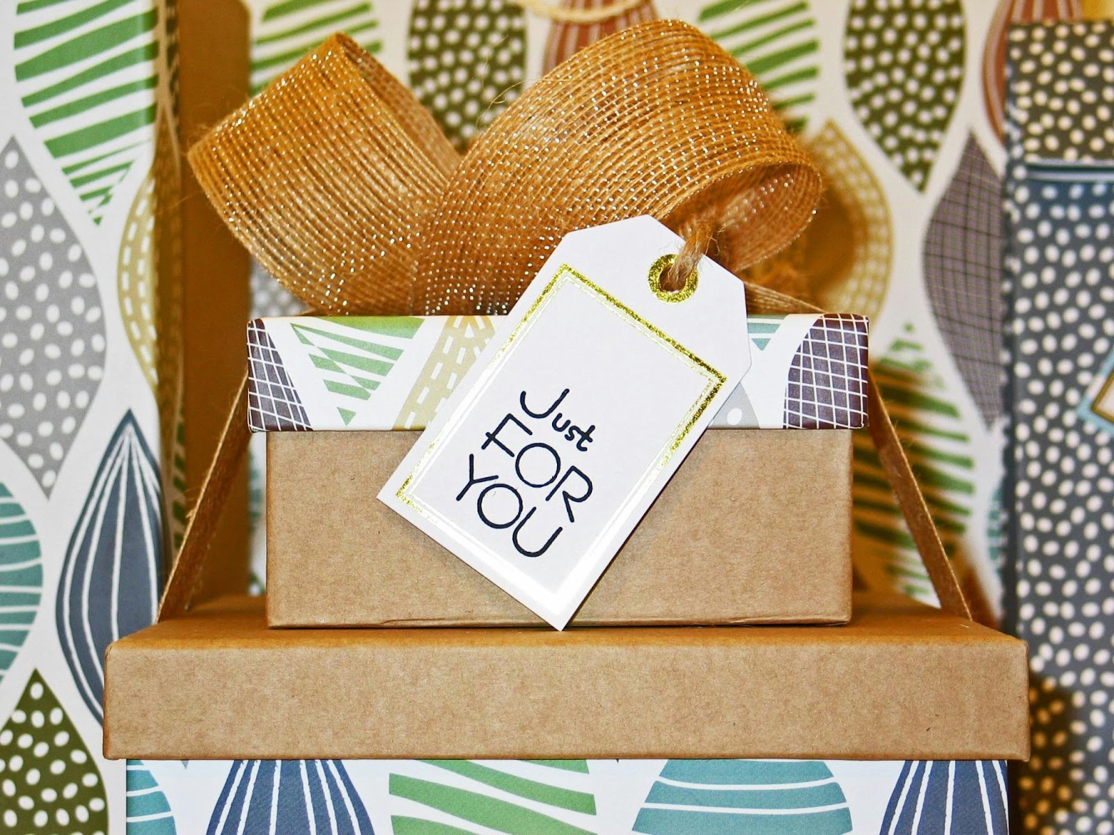 A pile of wrapped gifts with a label reading 'Just For You'.