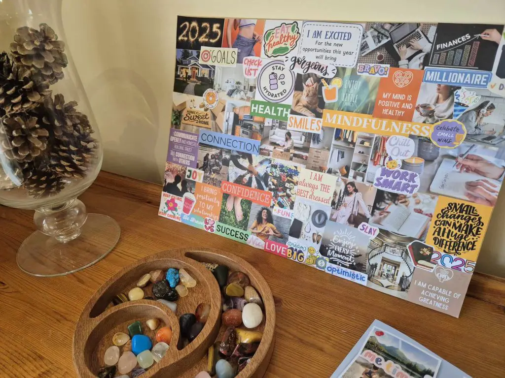 A completed vision board, propped up on a dresser with various ornaments around it.