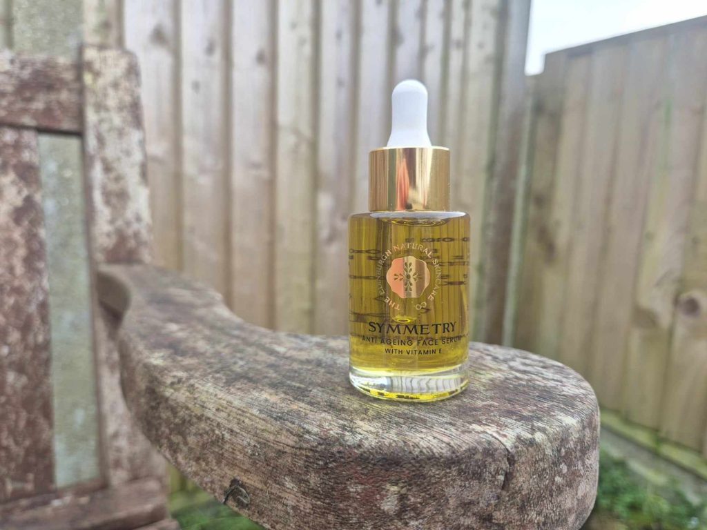 A bottle of The Edinburgh Natural Skincare Company Symmetry Anti Ageing Face Serum