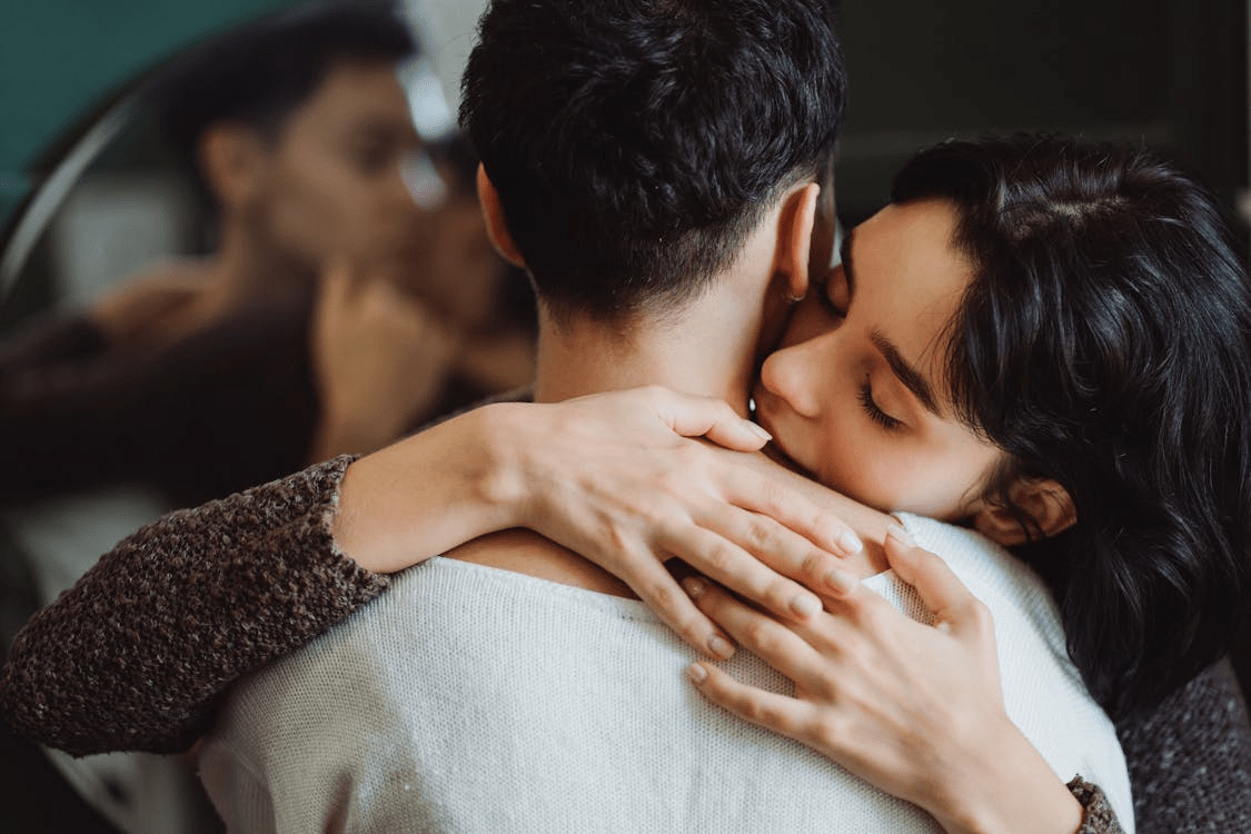 A couple hugging.